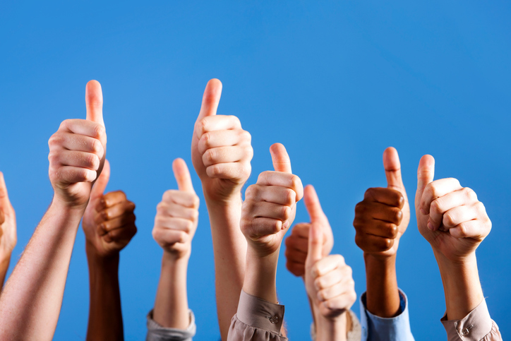 Many hands give group thumbs up of approval