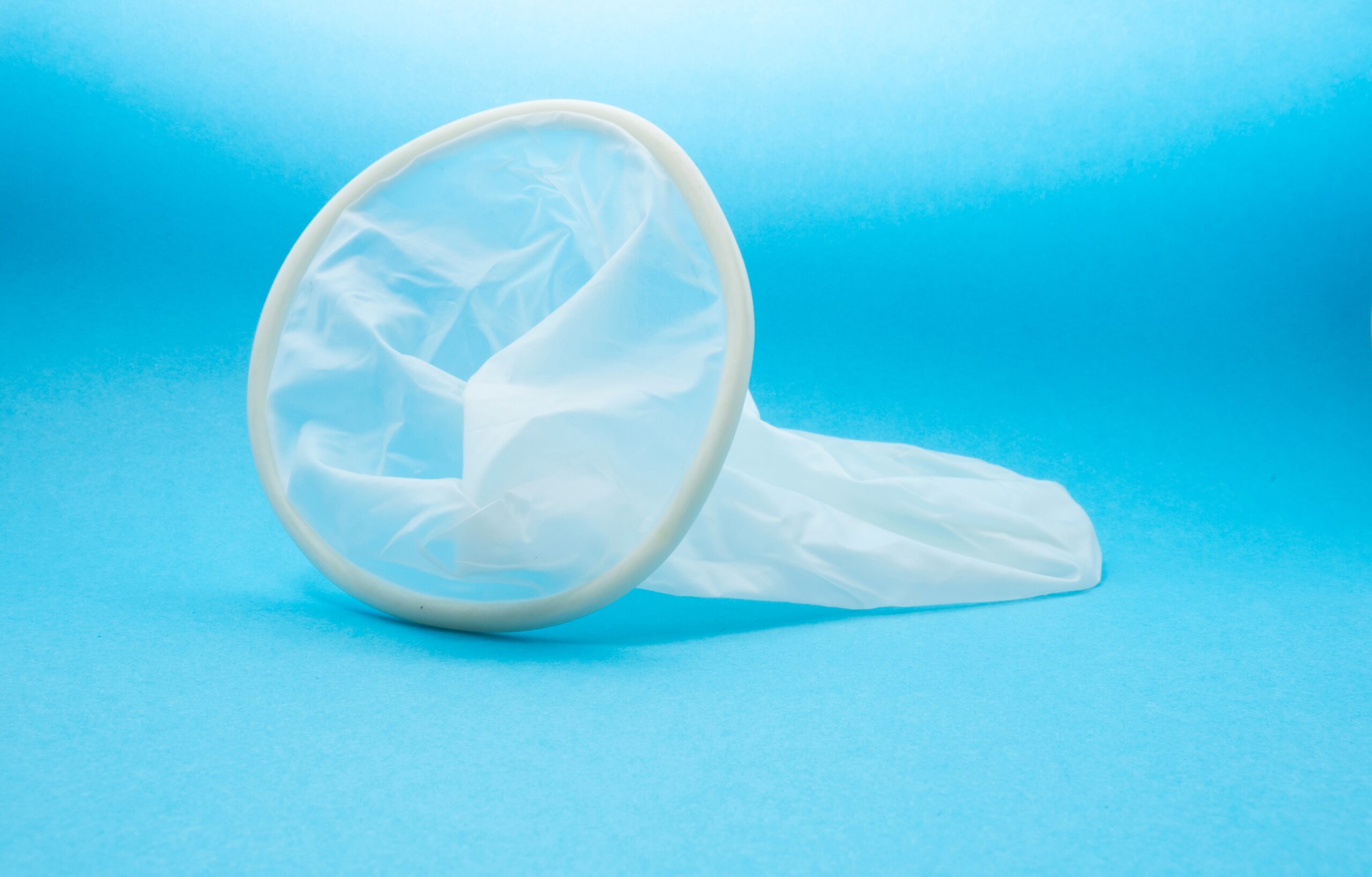 A female condom, which has two clear rings connected by clear plastic