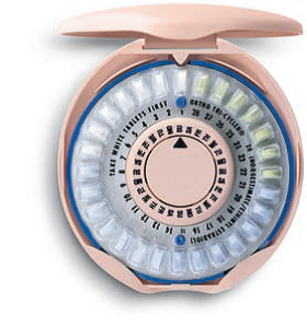 An opened plastic disc filled with a circular blister pack of oral contraception pills.