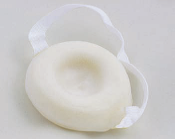 A small dish-shaped foam pad with a fabric loop attached.