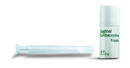 A plastic applicator beside a small cylindrical container of vaginal contraceptive foam.