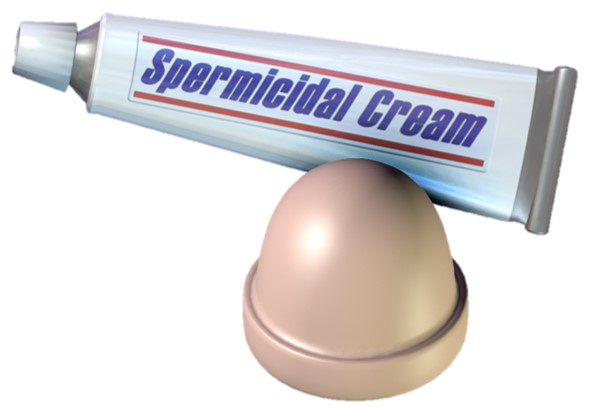 A beige dome shaped cervical cap with a tube of spermicidal cream next to it. 